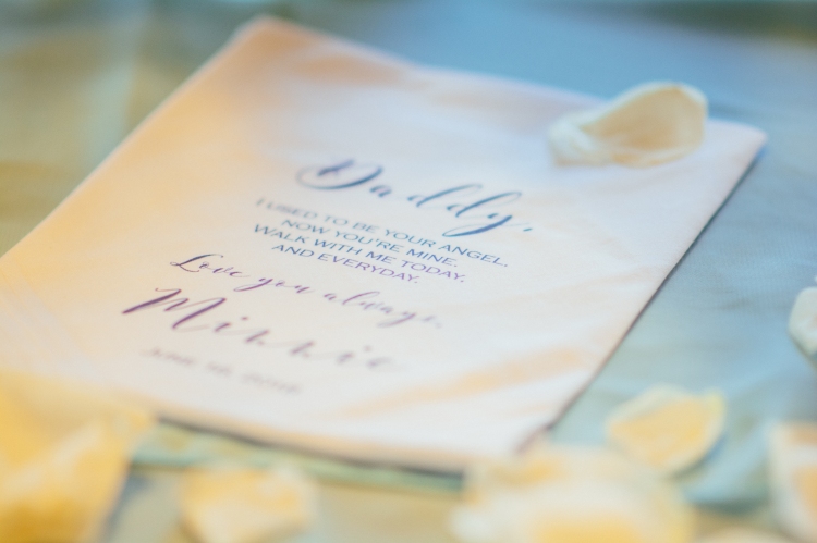 bokeh closeup of daddy daughter wedding message on handkerchief